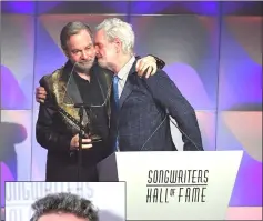  ??  ?? Singer Bob Gaudio presents Diamond (left) with the Johnny Mercer Award. (Inset) Lucian Grainge. — AFP photos