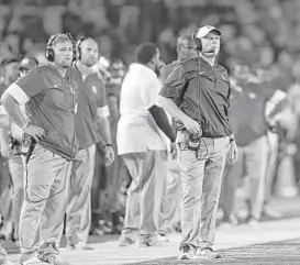  ?? Tim Warner / Houston Chronicle ?? Houston head coach Major Applewhite, right, has seen his team lose after taking first-half leads in consecutiv­e games, with the Cougars stumbling to 4-3 overall.