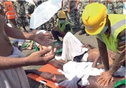  ?? PICTURE: EPA ?? EMERGENCY CARE: Pilgrims receive first aid attention after the stampede in Mina, near Mecca, Saudi Arabia yesterday.