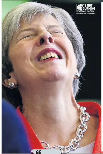  ??  ?? LADY’S NOT FOR GURNING Mrs May at the Tory conference yesterday