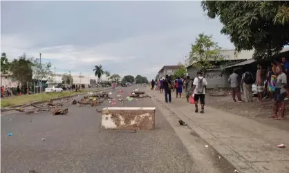  ?? Photograph: Georgina Kekea ?? Violent protests have broken out in the Solomon Islands’ capital, Honiara, for a second day, with witnesses saying Chinese-owned businesses were being targeted. Australia has deployed police and army to support ‘riot control’