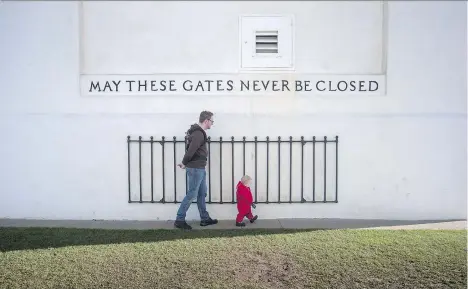  ?? DARRYL DYCK/THE CANADIAN PRESS ?? The phrase written on the Peace Arch at the Canada-U.S. border crossing in Surrey has taken on new meaning.