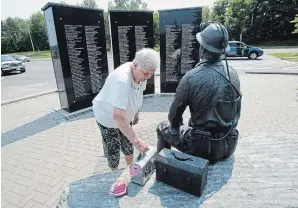  ??  ?? Left: Maxine brings the lunch box with her during a visit to the memorial for miners in Elliot Lake.