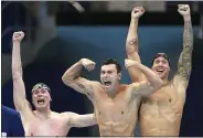  ?? MATTHIAS SCHRADER — THE ASSOCIATED PRESS ?? The United States men’s 4x100m freestyle relay team Bowen Beck, Blake Pieroni, and Caeleb Dressel celebrate after winning the gold medal Monday in Tokyo.