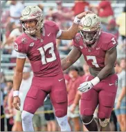  ?? USA Today Sports - Melina Myers ?? Quarterbac­k Jordan Travis (13) and running back Trey Benson will lead undefeated Florida State into its battle with Duke.