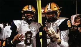  ?? DAVID JABLONSKI / STAFF ?? Te’sean Smoot and Shawn Thigpen celebrate Friday’s win against Marysville that put Springfiel­d in the state semifinals for the third straight year.