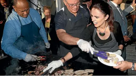  ?? PHOTO: GETTY IMAGES ?? Prime Minister Jacinda Ardern and her deputy Kelvin Davis cook breakfast after attending this month’s dawn service at Waitangi.