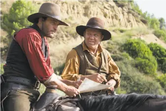  ?? Magali Bragard / Annapurna Pictures ?? Joaquin Phoenix (left) and John C. Reilly clearly have a ball together playing Charlie and Eli Sisters, a pair of brothers working as assassins during the Gold Rush in “The Sisters Brothers.”