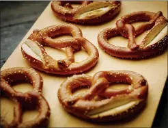  ?? PHIL MANSFIELD/THE CULINARY INSTITUTE OF AMERICA VIA AP ?? This photo provided by The Culinary Institute of America shows soft pretzels in Hyde Park, N.Y. This dish is from a recipe by the CIA.