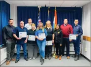  ?? PHOTO PROVIDED ?? From left, Deputy Director of Emergency Communicat­ions Andrew Cafaldo, Dispatcher Nicholas Secreto, Supervisor Michael Davis, Dispatcher Kathy Smith, Dispatcher Madison McDermott, Dispatcher Vickie Quent, Acting Ulster County Executive Johanna Contreras, Director of Emergency Services Everett Erichsen and Acting Supervisor Brad Fiore.