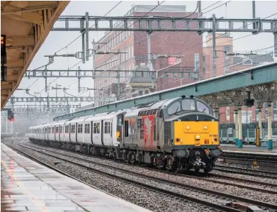  ?? JACK BOSKETT. ?? Rail Operations Group 37884 Cerpheus leads former Greater Anglia 321357 and 321446 through Newport on the final leg of their final main line journey on January 27, as they become the first Class 321s to be scrapped.