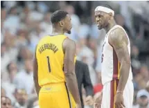  ?? MICHAEL LAUGHLIN/STAFF FILE PHOTO ?? Miami Heat forward LeBron James snarls at Indiana Pacers guard Lance Stephenson during the 2014 Eastern Conference finals.