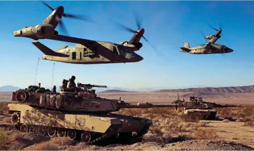  ??  ?? TILTROTORS IN ACTION: A BELL RENDERING OF V-280 VALOR OPERATING WITH M1A2 ABRAMS MAIN BATTLE TANKS