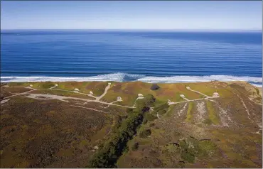  ?? PHOTO BY LIPO CHING ?? Bunkers line the Monterey Bay coast in an aerial view of the planned campground site at Fort Ord Dunes State Park on Wednesday. Campsite spaces will be developed inland at the bottom left and RV spaces at the bottom right.