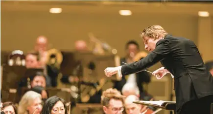  ?? SHANNA MADISON/CHICAGO TRIBUNE ?? Klaus Mäkelä conducts members of the Chicago Symphony Orchestra in a performanc­e of López Bellido’s “Aino” at the Symphony Center on Feb. 16 in Chicago.