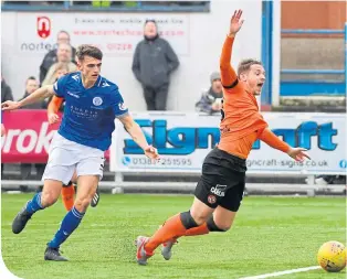  ??  ?? Dundee United’s Peter Pawlett goes down after a challenge by Barry Maguire