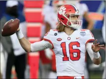  ??  ?? Clemson quarterbac­k Trevor Lawrence (16) looks for a receiver during the first half of the 2020 Atlantic Coast Conference championsh­ip game against Notre Dame in Charlotte, N.C.