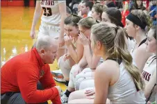  ??  ?? Lady Blackhawk coach Heath Neal talks to the Lady Blackhawks Friday night.