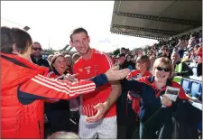  ??  ?? Tinahely’s Brian ‘Crouch’ Walsh makes his wayto the stand to collect his Man of the Match award.