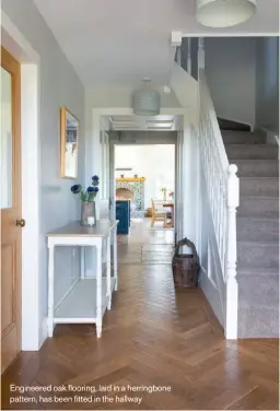  ??  ?? Engineered oak flooring, laid in a herringbon­e pattern, has been fitted in the hallway