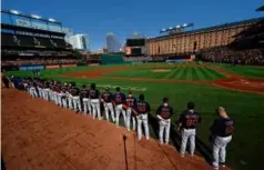  ?? JULIO CORTEZ/ASSOCIATED PRESS ?? Sox players lined up for a moment of silence to honor Mr. Wakefield before a game Sunday in Baltimore.