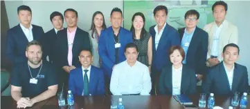  ??  ?? Lim (standing, centre) with his peers from Young Global Leaders after a closed-door discussion with Azmin (seated centre).