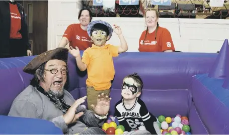  ??  ?? At the Co-op charity fun day are, from left, Captain Raggedy Beard, store manager Victoria Wright, four-year-old Khan Ahmadi, Co-op community pioneer Gemma Robinson, and four-year-old Charley Robinson.