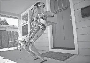  ?? FORD ?? Digit the robot moves like a human and can lift packages weighing as much as 40 pounds. It also can climb stairs and navigate uneven terrain.