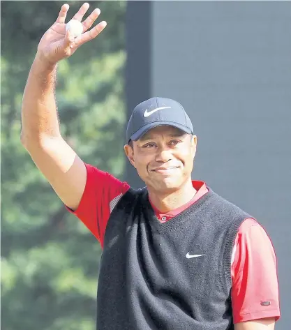  ??  ?? Tiger Woods celebrates his win at the Zozo Championsh­ip.