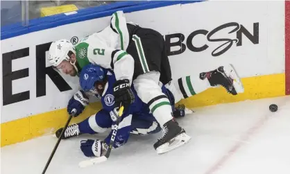  ??  ?? Dallas Stars defenseman Jamie Oleksiak (2) checks Tampa Bay Lightning right wing Nikita Kucherov (86) during the third period of Saturday night’s Game 1 of the Stanley Cup final. Photograph: Jason Franson/AP