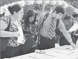  ?? Anne Cusack Los Angeles Times ?? CALIFORNIA’S JOBLESS RATE of 10.2% is at its lowest level since March 2009. Above, job seekers attend a job fair Thursday at Los Angeles City College.