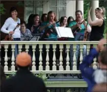  ?? RECORD FILE PHOTO ?? Members of the Royal City Ukulele Ensemble accept applause after performing at the Grand Porch Party in Waterloo last year.