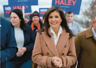  ?? JOE RAEDLE/GETTY ?? Nikki Haley visits a polling location in Hampton, New Hampshire on Tuesday.