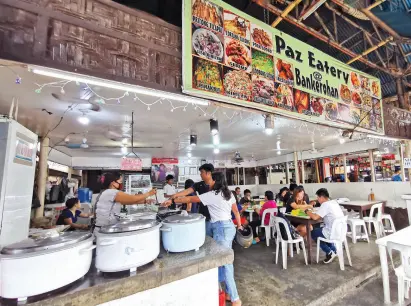  ??  ?? FRESHLY cooked food attracts diner to this humble eatery