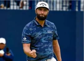  ?? JON SUPER/ASSOCIATED PRESS ?? Jon Rahm celebrates his historic round of 63, the lowest ever at Royal Liverpool, to get to 6 under par for the tournament.