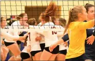  ?? MATTHEW B. MOWERY — MEDIANEWS GROUP ?? The No. 8-ranked Cass City Red Hawks celebrate in the background, after a 25-20, 25-22, 25-18 win over Royal Oak Shrine (foreground) in a D3quarterf­inal Tuesday.