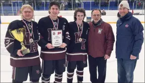 ?? Dave Phillips / For Heart Connecticu­t Media ?? North Haven captains, Coach Chrsi Avena and SCC Commission­er Al Carbone with the SCC Division II hockey championsh­ip trophy.