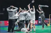  ?? AP/AFP ?? (Left) Srikanth Kidambi after winning a point against Indonesia's Jonatan Christie; (above) members of the Indian men’s team celebrate after winning their first Thomas Cup crown.