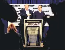 ?? Dan Levine AFP/Getty Images ?? BALLMER, left, took over management of Microsoft in 2000 when Bill Gates stepped down at the software giant.