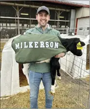  ?? COURTESY OF JARED KURTZ ?? Jared Kurtz with “Milkerson,” one of five new cows named for Eagles players at Kurtland Farms near Elverson.