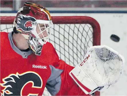  ?? Gavin Young/Calgary Herald ?? Calgary Flames goalie Reto Berra helped his team beat the Nashville Predators in a shootout Friday night at the Scotiabank Saddledome.