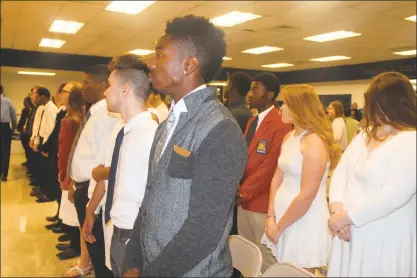  ??  ?? Students stand for the presentati­on of the flag during the Robert D. Stethem Education Center’s Recognitio­n Ceremony Thursday. The center held a recognitio­n ceremony for 53 seniors from Charles County high schools who completed 2.5-year Career and...