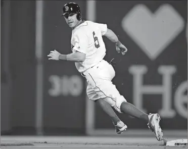  ?? CHARLES KRUPA/AP PHOTO ?? Ian Kinsler, the newest member of the Red Sox, looks back as he rounds second base after advancing on a pickoff attempt during the fourth inning of Tuesday night’s game against the Philadelph­ia Phillies at Fenway Park. The Phillies beat the Red Sox 3-1.