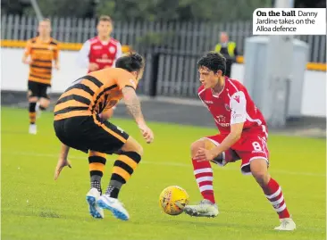  ??  ?? On the ball Danny Jardine takes on the Alloa defence