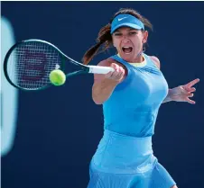  ?? — AFP photo ?? Halep returns a shot to Badosa during her women’s singles match during the Miami Open at Hard Rock Stadium in Miami Gardens, Florida.