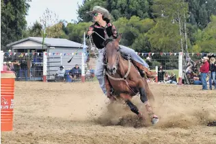  ??  ?? Long way to the top . . . Rhondine Long, of Oamaru, on her way to winning the open barrel race.