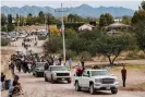  ?? Photograph: Carlos Jasso/Reuters ?? A convoy of SUVs at the victims’ funerals on Thursday.