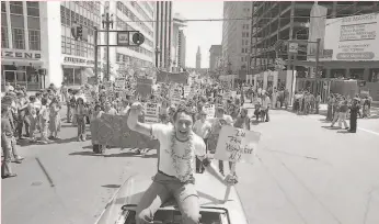  ?? Terry Schmitt / The Chronicle 1978 ?? Harvey Milk, the country’s most visible gay elected official at the time, helped the Pride parade soar to new heights with his appearance in 1978.