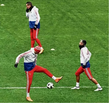  ?? — AFP ?? No time to rest: Russia forwards Anton Zabolotny (top) and Fyodor Smolov (centre) and midfielder Alexander Samedov taking part in a training session at the Luzhniki Stadium in Moscow yesterday.