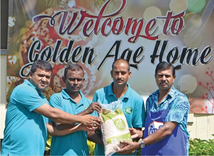  ?? Photo: Laisa Lui ?? From left: Fiji Rice Limited general manager Ashrit Pratap with workers, Sujeshwar Dutt, Niteshwar Chandra, handing over the package to Golden Age Home - Labasa chef, Jay Nand.